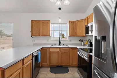 1467 W Plaza De Los Leones Dr, Pueblo West, CO 81007 - Photo 14
