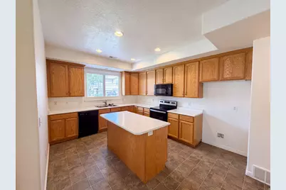 6943 W Bamburgh Way, West Valley, UT 84128 - Photo 2