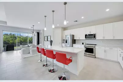 303 Indies Drive W #201, Naples, FL 34114 - Photo 1