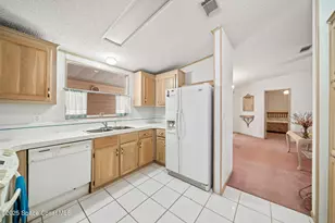 720 Periwinkle Cir, Barefoot Bay, FL 32976 - Photo 14