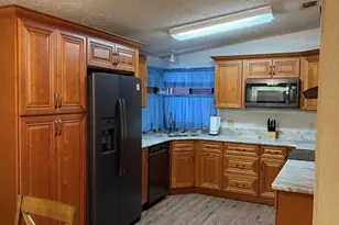 706 Hyacinth Cir, Barefoot Bay, FL 32976 - Photo 4
