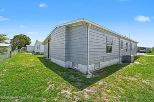 911 Hyacinth Cir, Barefoot Bay, FL 32976 - Photo 24