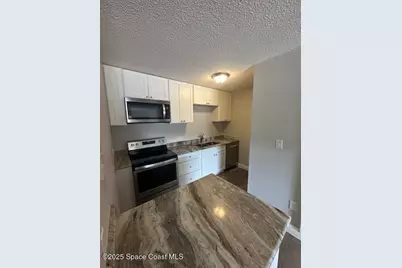 225 S Tropical Trail #205, Merritt Island, FL 32952 - Photo 4