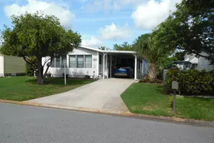 715 Gladiolus Dr E, Barefoot Bay, FL 32976 - Photo 1