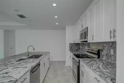 1037 Cheney Ave S, Lehigh Acres, FL 33974 - Photo 12