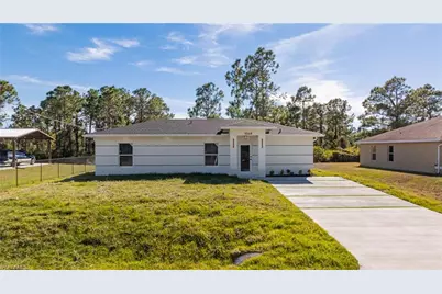 1120 Ravenswood St E, Lehigh Acres, FL 33974 - Photo 1