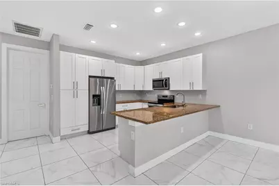 702 Norman Ave N, Lehigh Acres, FL 33971 - Photo 10