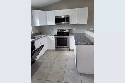 1117 Gordon Ave S, Lehigh Acres, FL 33973 - Photo 6