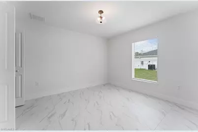 1042 Cheney Ave S, Lehigh Acres, FL 33974 - Photo 28