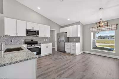 409 NE 25th Ter, Cape Coral, FL 33909 - Photo 6