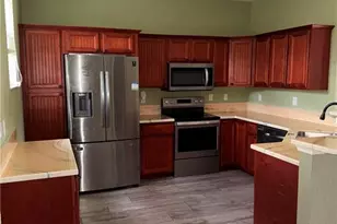 1154 Damen St E, Lehigh Acres, FL 33974 - Photo 2