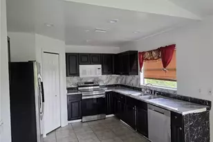 409 Hull Ave S, Lehigh Acres, FL 33974 - Photo 10