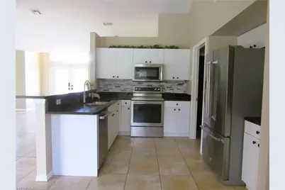 1303 SW 34th St, Cape Coral, FL 33914 - Photo 6