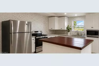 611 NE 23rd Ter, Cape Coral, FL 33909 - Photo 2