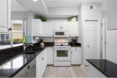 2295 Carrington Ct #1-104, Naples, FL 34109 - Photo 6