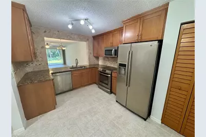 661 Squire Cir #101, Naples, FL 34104 - Photo 2