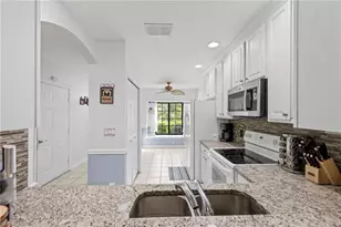 7715 Woodbrook Cir, Naples, FL 34104 - Photo 2