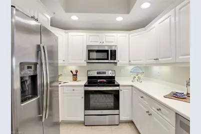 1001 Arbor Lake Dr #102, Naples, FL 34110 - Photo 6