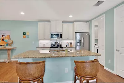 14891 Edgewater Cir, Naples, FL 34114 - Photo 6