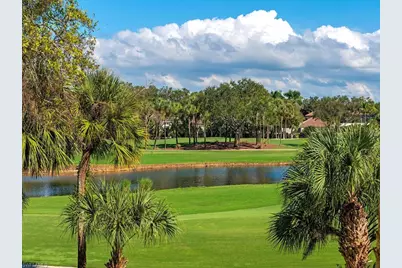 7032 Pelican Bay Blvd #E202, Naples, FL 34108 - Photo 1