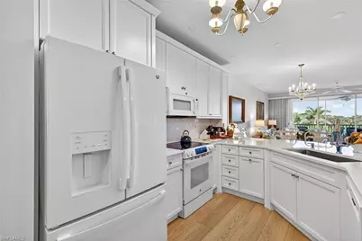 7687 Pebble Creek Cir #303, Naples, FL 34108 - Photo 6