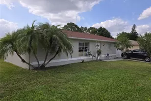 909 Sally Ave N, Lehigh Acres, FL 33971 - Photo 2