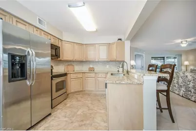 9589 Crescent Garden Dr #C-102, Naples, FL 34109 - Photo 1