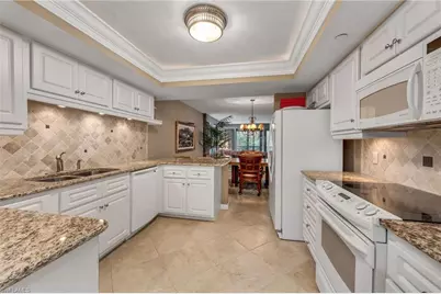 6040 Pelican Bay Blvd #D-105, Naples, FL 34108 - Photo 4