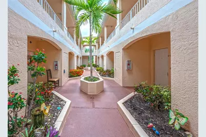 1096 Woodshire Ln #C210, Naples, FL 34105 - Photo 1