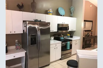 2855 Cypress Trace Circle Cir NW #202, Naples, FL 34119 - Photo 4