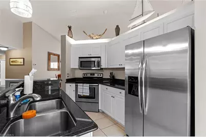 1057 Silverstrand Dr, Naples, FL 34110 - Photo 10