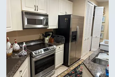 1390 Sweetwater Cv #203, Naples, FL 34110 - Photo 2