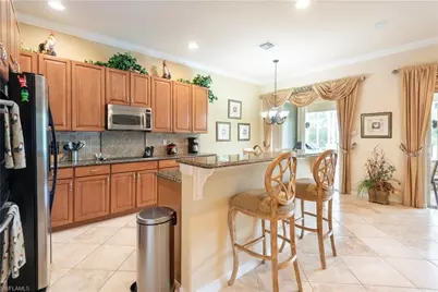5725 Lago Villaggio Way, Naples, FL 34104 - Photo 26