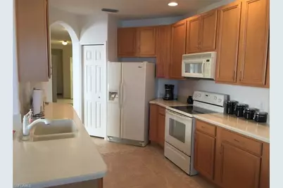 6825 Sterling Greens Dr #102, Naples, FL 34104 - Photo 2