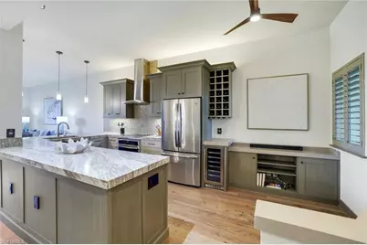 7655 Pebble Creek Cir #404, Naples, FL 34108 - Photo 2