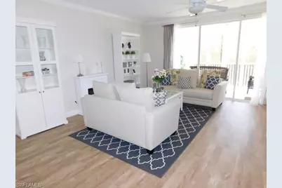 7655 Pebble Creek Cir #302, Naples, FL 34108 - Photo 1