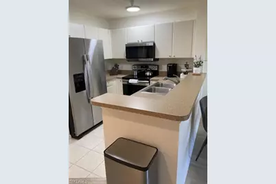 4430 Botanical Place Cir #303, Naples, FL 34112 - Photo 12
