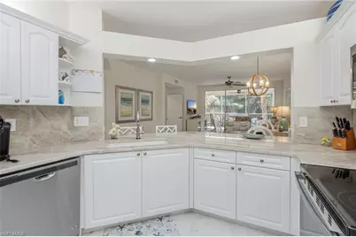 7693 Pebble Creek Cir #104, Naples, FL 34108 - Photo 10