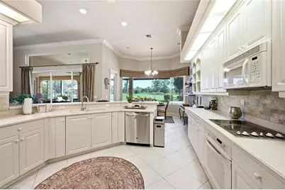 5872 Whisperwood Ct, Naples, FL 34110 - Photo 18