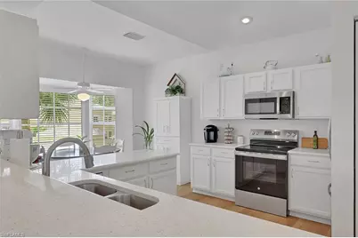 680 Wiggins Lake Dr #202, Naples, FL 34110 - Photo 2