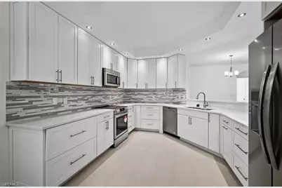 7056 Pelican Bay Blvd #B102, Naples, FL 34108 - Photo 1