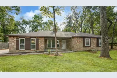 222 Ridgewood Drive, Oak Ridge North, TX 77386 - Photo 1