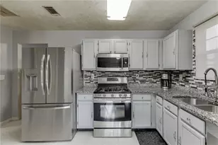 5160 Arrowind Rd NW, Lilburn, GA 30047 - Photo 6