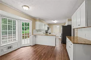3884 Hunting Ridge Dr SW, Lilburn, GA 30047 - Photo 6