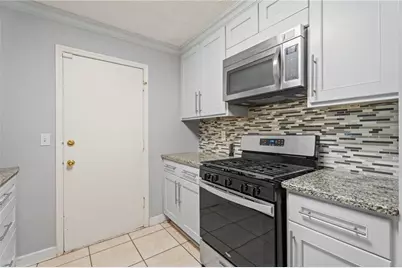 661 Sunfield Drive NW, Lilburn, GA 30047 - Photo 18