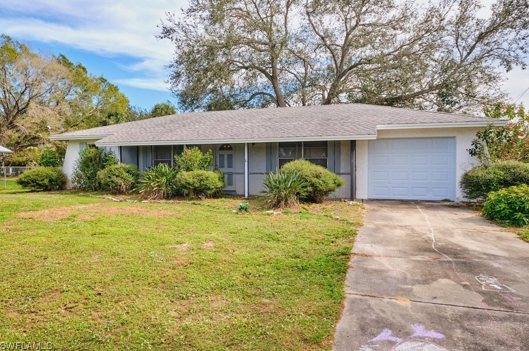302 Thompson Ave, Lehigh Acres, FL 33936-5235