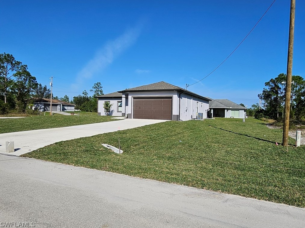 651 Keller St, Lehigh Acres FL 33974-7560 exterior