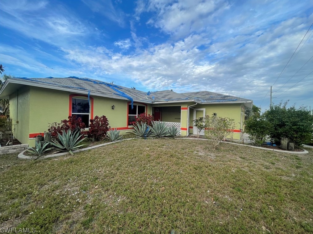 309 8th St, Cape Coral, FL 33990-1557