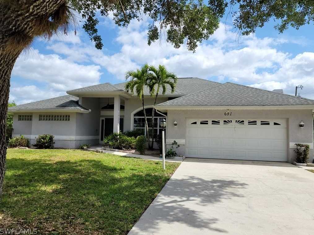 697 Creuset Ave, Lehigh Acres, FL 33974-9740