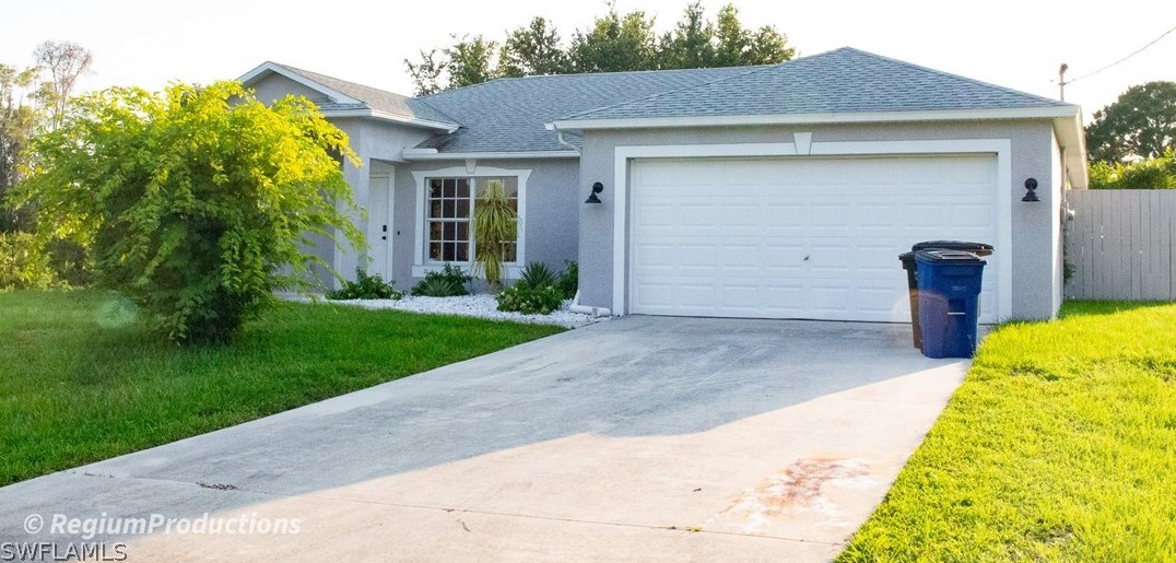 720 Bedford Point Ave, Lehigh Acres, FL 33974-3614